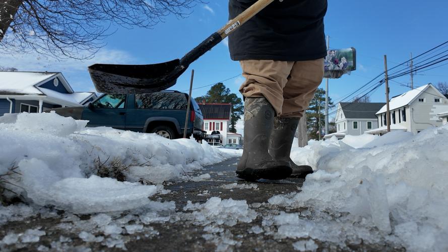 Scraping Ice on Greenwood Sidewalk