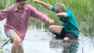 Two Kids in the Muddy Marsh