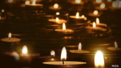 Numerous lit tealights