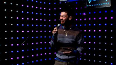 young man singing with mic on mid south audio stage
