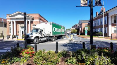 A truck driving through downtown Georgetown. 