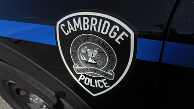 The Cambridge Police crest on a patrol car.