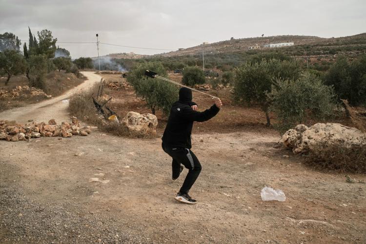 Photos show Israeli settler attacks disrupting the West Bank olive harvest