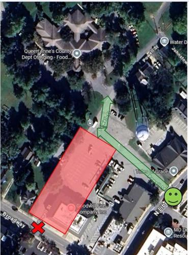 A satellite map image shows a closed parking lot highlighted in red and a detour route highlighted in green.