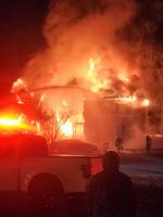 Cambridge Home Engulfed in Flames Following Reported Explosion