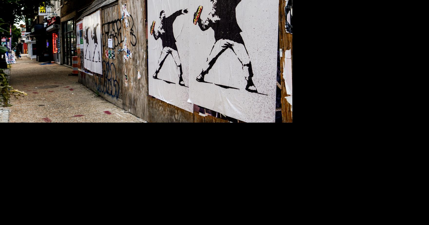 Man who threw sandwich at federal agent calls it an act of protest. Prosecutors argue it's a crime