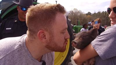 Corey Kisses a Pig