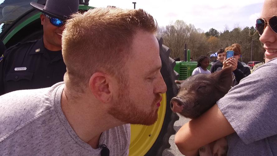 Corey Kisses a Pig