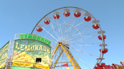 Lemonade stand and ferris wheel at Delaware State Fair.