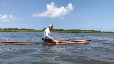 A man sitting on a paddleboard