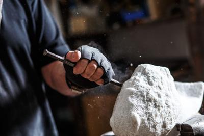 Senior sculptor working on his sculpture
