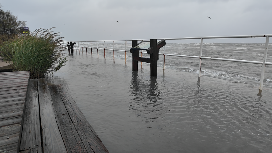 Viewing area next to the Ocean City Inlet parking lot completely underwater during high tide.
