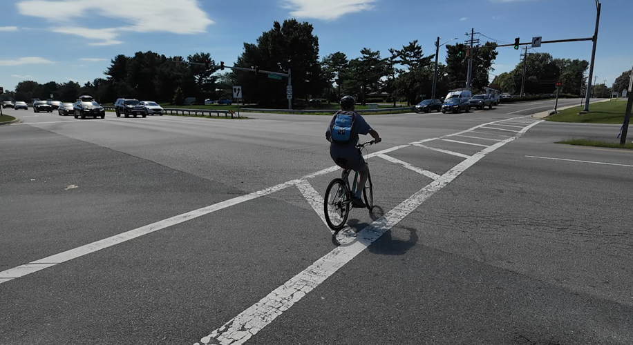 A bicyclist crossing Route 50 in Easton.