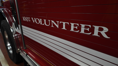 The side of an Easton, Maryland firetruck that reads "100% Volunteer."
