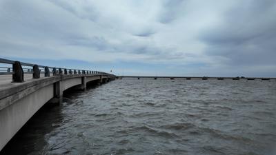 Bay water disrupted by a coastal storm beats against the pilings of the Chincoteague causeway. 