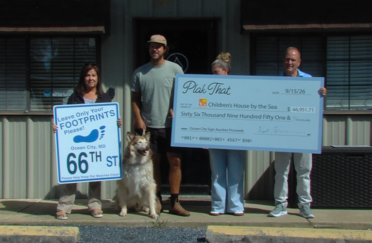 Plak That presenting giant check to Believe in Tomorrow Children's Foundation.