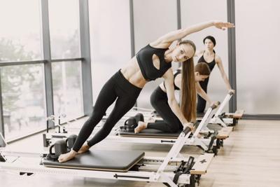 Reformer Pilates: NYC Experts Explain What to Expect From a Class