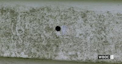 A bullet hole in the side of a Linkwood home left after a shooting that claimed the life of a five-year-old child