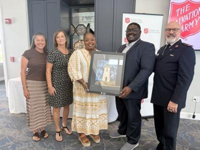 Draper Media's Troy Brittingham, Sharon Harrington, and NaKisha Johnson representing Bless Our Children, with Mariah Calagione representing Draper Holdings Charitable Foundation, accepting The Salvation Army Delaware's Doing the Most Good Award
