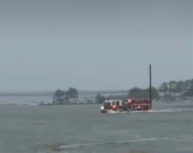 IRVFC truck responding to garage fire in high floodwaters