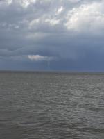An apparent water spout forms south of Bowers Beach