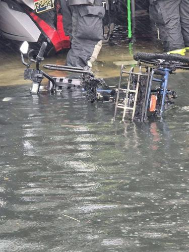 Destroyed e-bike in floodwaters after IRVFC response.