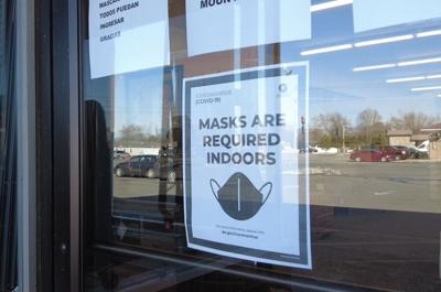 Mask Sign Posted on Window