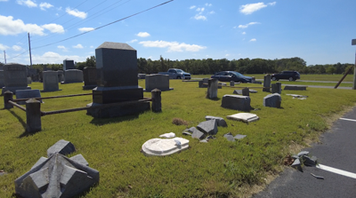 Damaged gravestones after hit-and-run incident