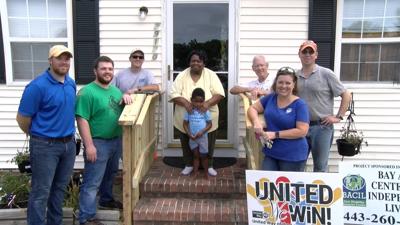 Perdue Farms and Chesapeake Housing Mission Gift Woman with Stair Railings