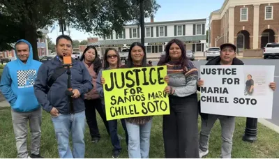 Neighbors gathered outside of the Georgetown Courthouse to support Santos Maria Chilel Soto. Two signs read "Justice for Santos Maria Chilel Soto."