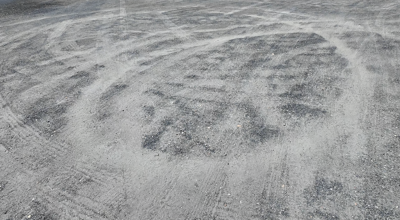 Tire marks from someone 'doing donuts' in the Secretary Volunteer Fire Company's parking lot. 