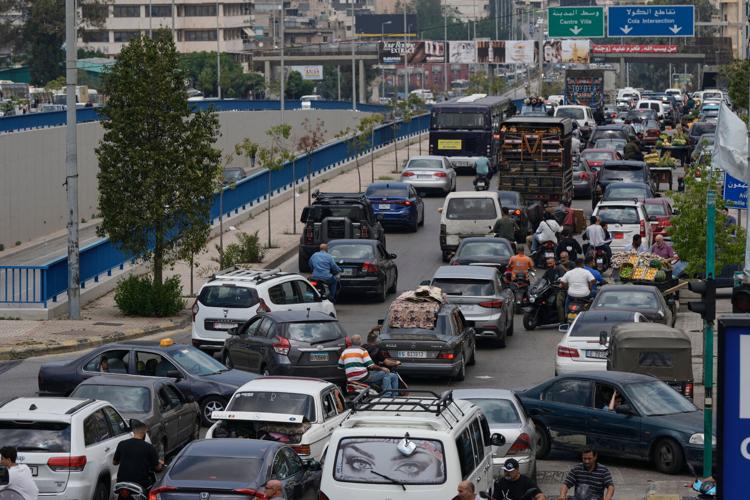 A Lebanese hospital is in ruins and people flee a Beirut suburb after Israel's threat, in photos