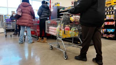 Shoppers check out at the grocery store
