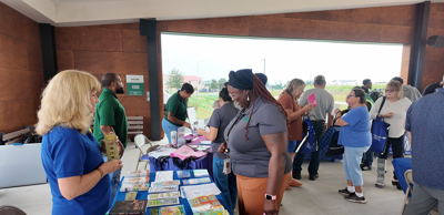 Community organizations speaking to people at the Food Bank of Delaware.