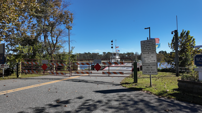 a closed gate in front of the entry to the Woodland Ferry