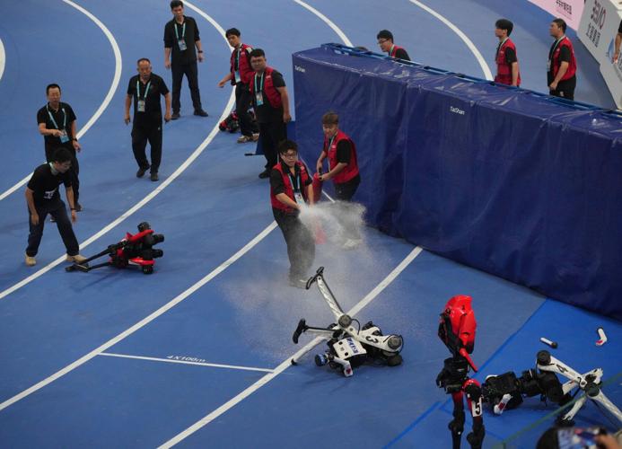 Humanoid robots sprint, play soccer and set records at Beijing games, in photos