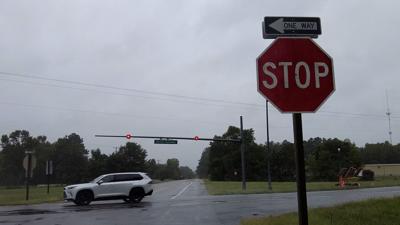 The intersection of Route 50 and Whaleyville Road. Stop sign is pictured to the right of the photo, with a car driving eastbound on Route 50. 