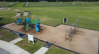 Playground with sports fields in the background