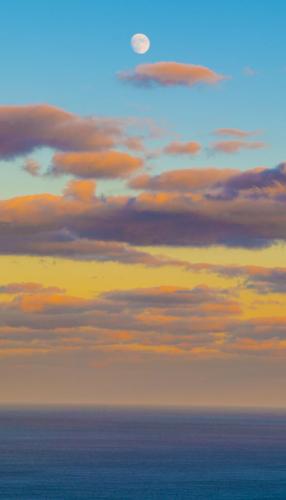 Sometimes we forget that we can see the moon much earlier with the time change, a look into the Atlantic Ocean at sunset