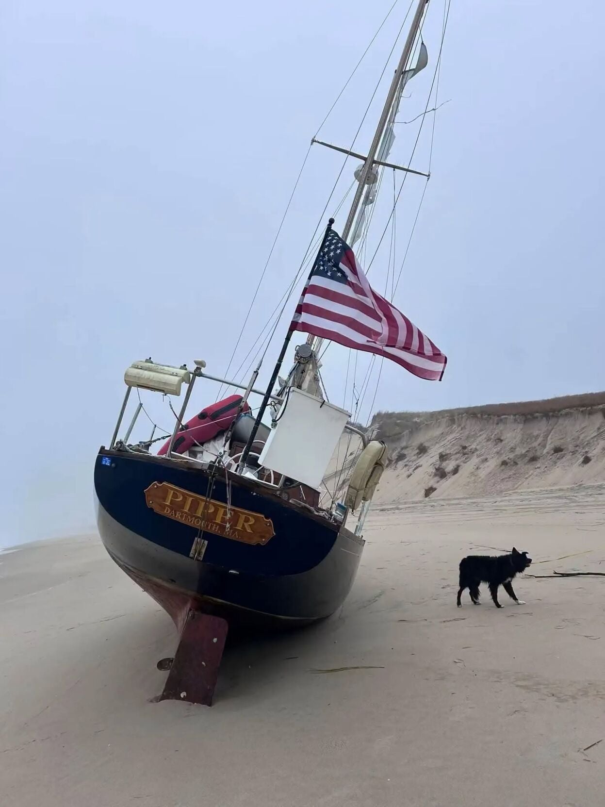 A sailboat called "Piper" washed up on the beach at Cape Henlopen