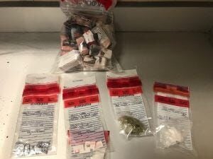 4 Arrested After Guns & Drugs Found in Greenwood Home