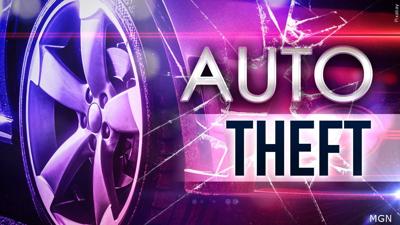 Close up of a car wheel with the words "auto theft" across it.