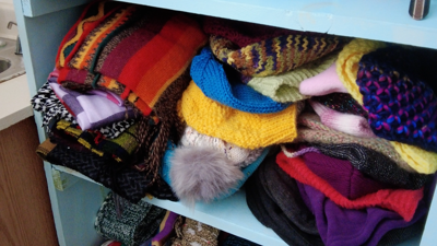 Hats and scarves in a shelter