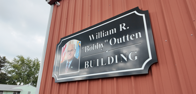 William R. "Bobby" Outten signage on recreation building at Harrington Park.