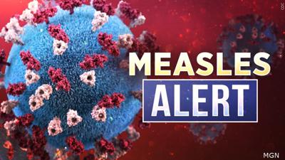 Measles alert with rendering of the virus