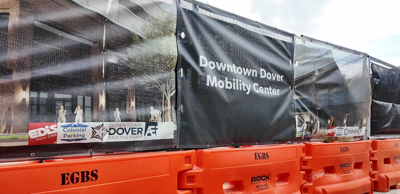 Fencing and orange barricades around the Downtown Dover Mobility Center.