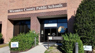 The outside of an office building with a sign reading Wicomico County Public Schools. 