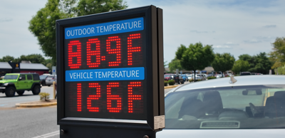 Changing temperatures on a sign that shows the outdoor temperature as 88.9 degrees Fahrenheit and the vehicle temperature as 126 degrees Fahrenheit. 