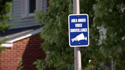 Sign that says "Area Under Video Surveillance" near the alley.