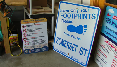 Old Ocean City boardwalk signs, one says Boardwalk Ordinances, other says "Leave Only Your Footprints Please!" and "Somerset St."